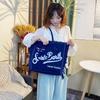 Large Capacity Canvas Tote Bag with Denim Fabric and Tassel Design for Commuting
