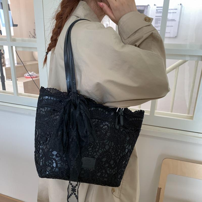 Niche large-capacity woven bag tote bag autumn new hollow lazy wind shoulder armpit bag beach bag
