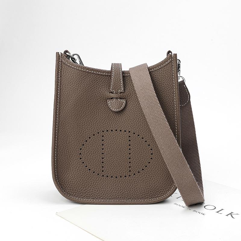 Factory wholesale first layer togo cowhide bucket bag women's bag lychee pattern hollow single shoulder crossbody bag hollow design