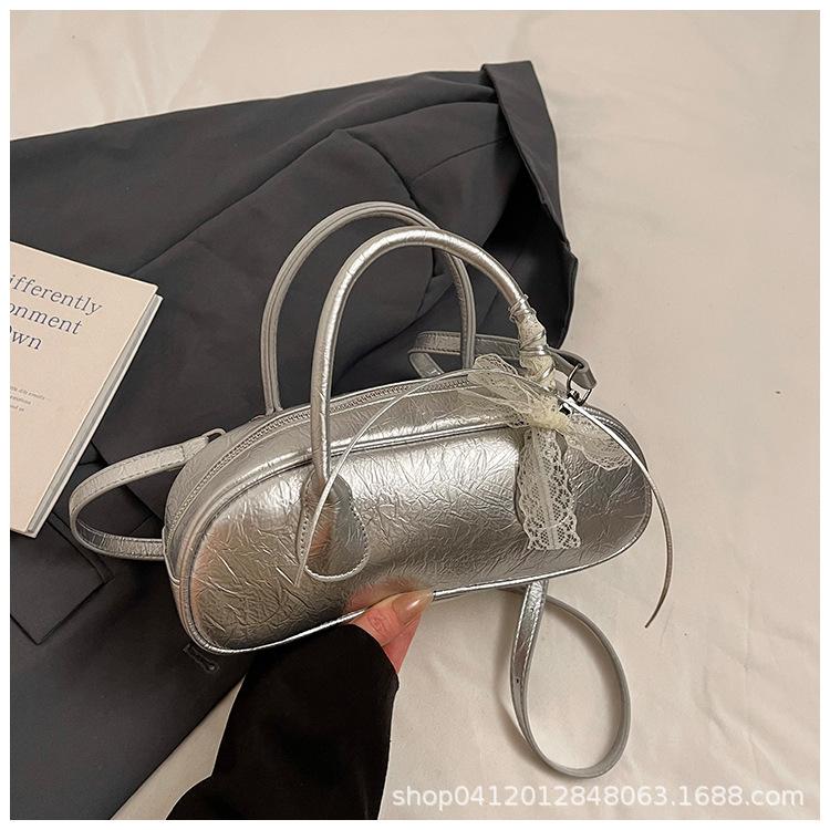 

This year, the popular foreign-style small bag women s 2025 spring and summer new fashion messenger bag niche portable work commuter bag срібний