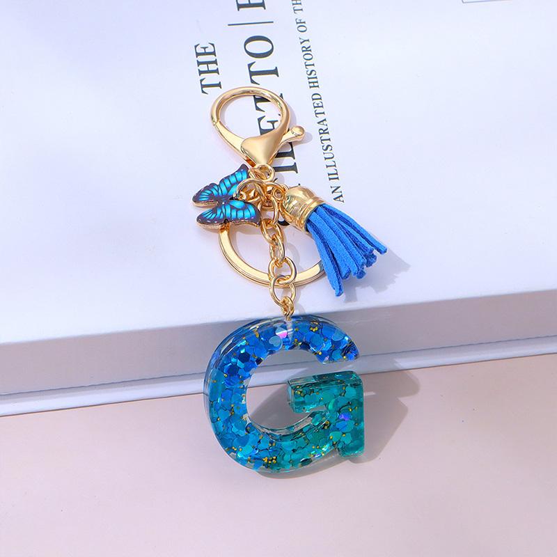 1 Stück Schriftzug Schlüsselanhänger für Rucksackanhänger Schlüsselanhänger Schlüsselring mit Quaste Schmetterling Niedlich Farbverlauf Harz Blau Pailletten