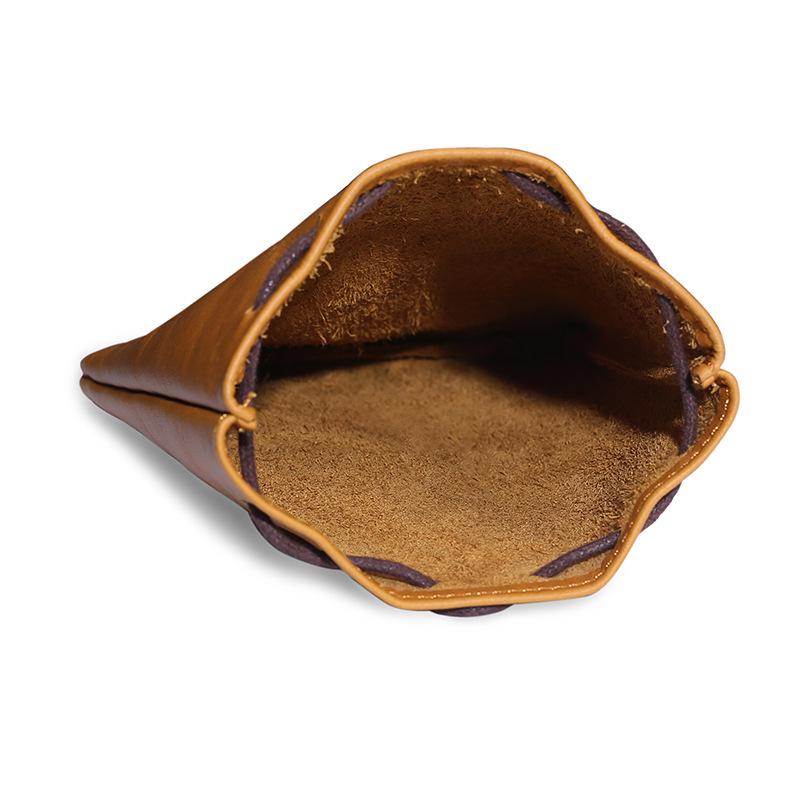 Cowhide Coin Purse: Retro Gift and Auspicious Blessing Bag for Men and Women with Creative Drawstring Design.