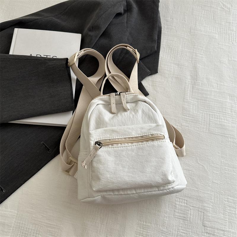 

Простой повседневный мини-рюкзак для женщин 2025, новая модная однотонная маленькая сумка, небольшой свежий студенческий дорожный рюкзак белый