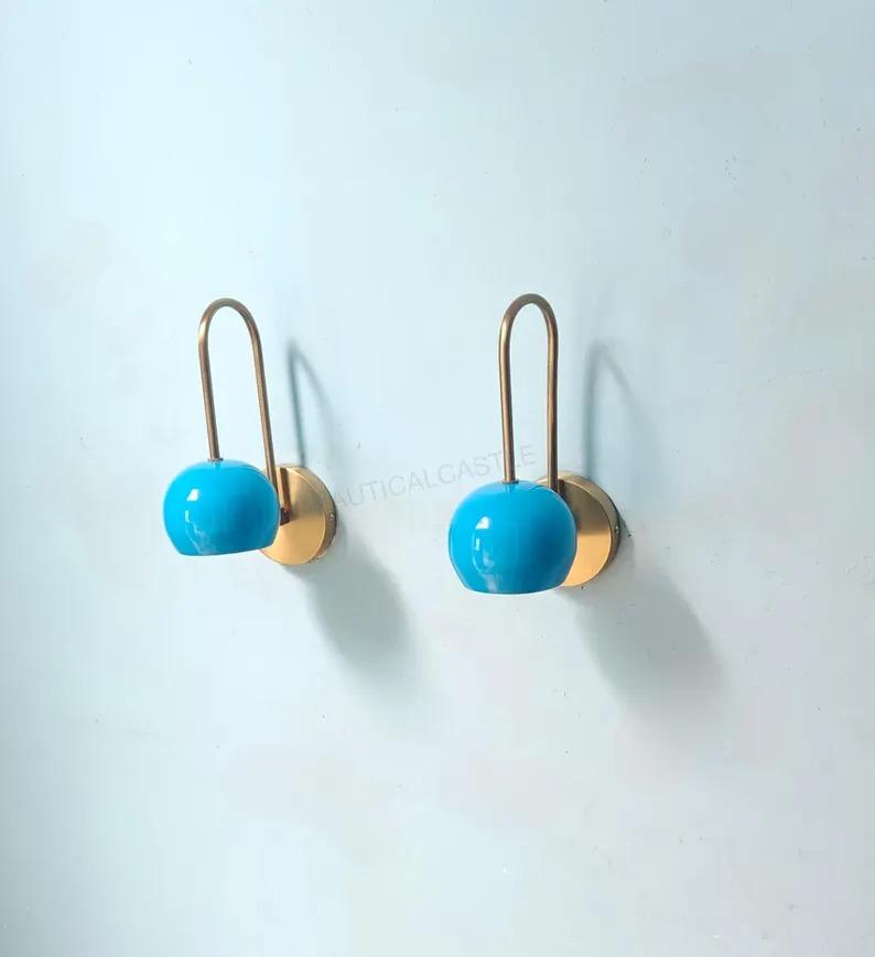

Pair of Mid-Century Modern Brass Wall Sconces with Blue Ball Lights синій