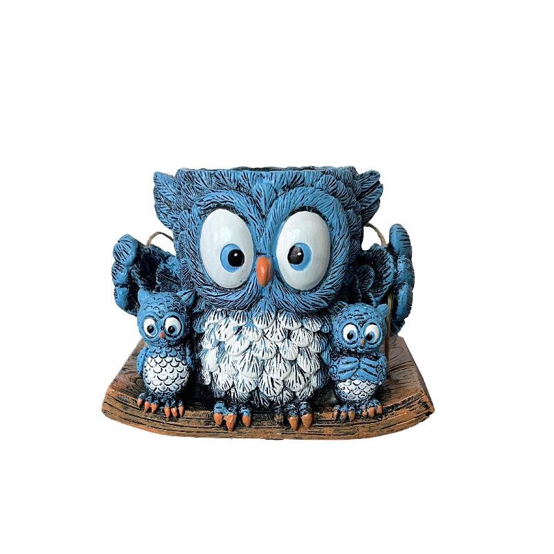 An Owl Hanging A Succulent Decoration In A Flower Pot As A Gift