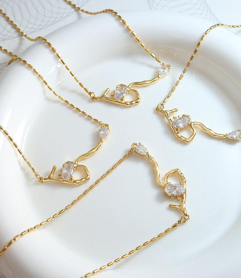 Celebrity-Inspired Gold-Plated Titanium Steel Necklace with Zircon Root-Shaped Pendant