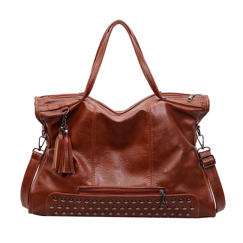 

Stylish PU Tote Bag for Women – Fashionable Stud Detail & Tassel Accent, Dual Handle & Shoulder Strap – Perfect for Work and Everyday Use коричневий