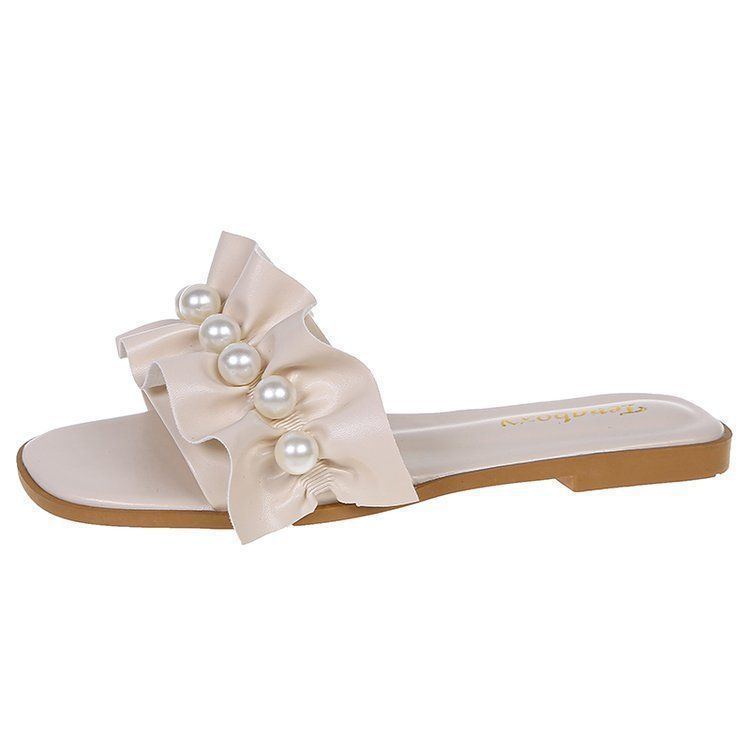 Cool slippers women's summer outer wear ins tide 2025 new fashion fairy wind sweet pearl flower flat bottom one-word drag