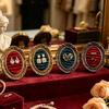 Ring Display Tray with Multiple Horizontal Slots, Ornate Oval Scrollwork Frame and Flat Base for Tabletop Presentation
