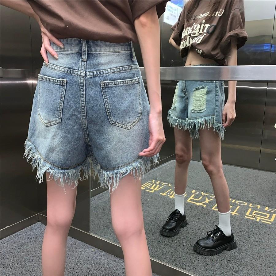 Pantaloni da donna larghi a gamba larga con nappe sfrangiati a vita alta a trapezio strappati