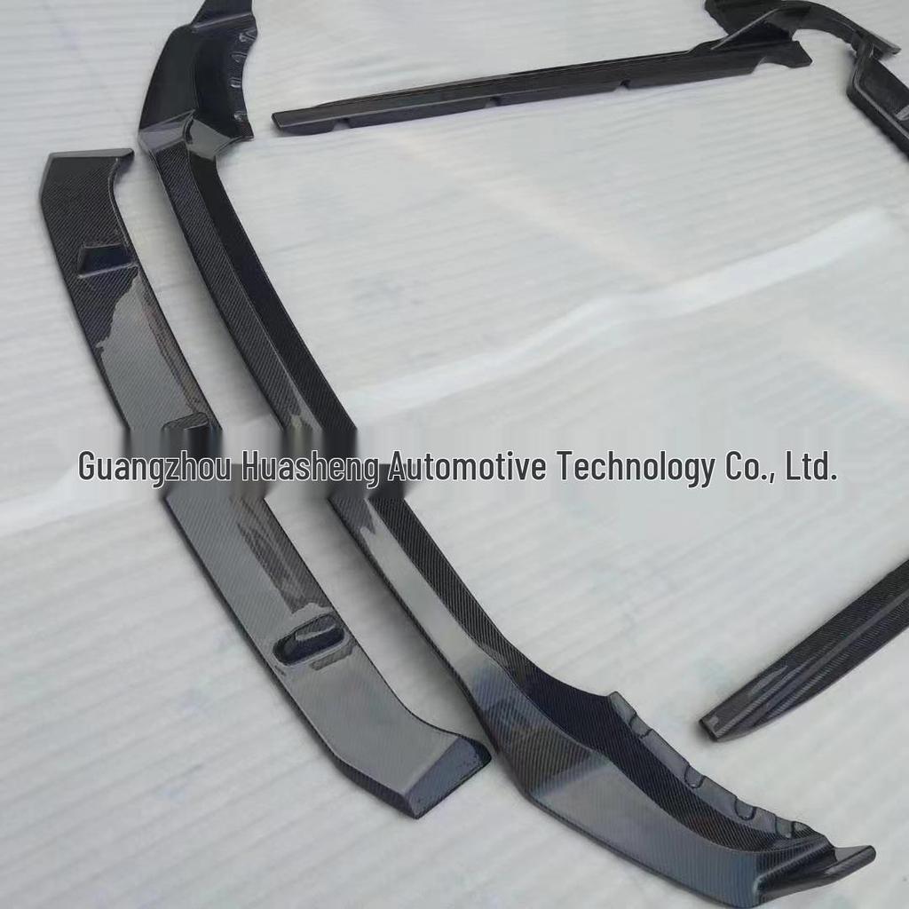 BMW X5 G05 Carbon Fiber Black Warrior Kit: Head Shovel, Front Lip, Side Skirts, Rear Wing, and Corner Spats.