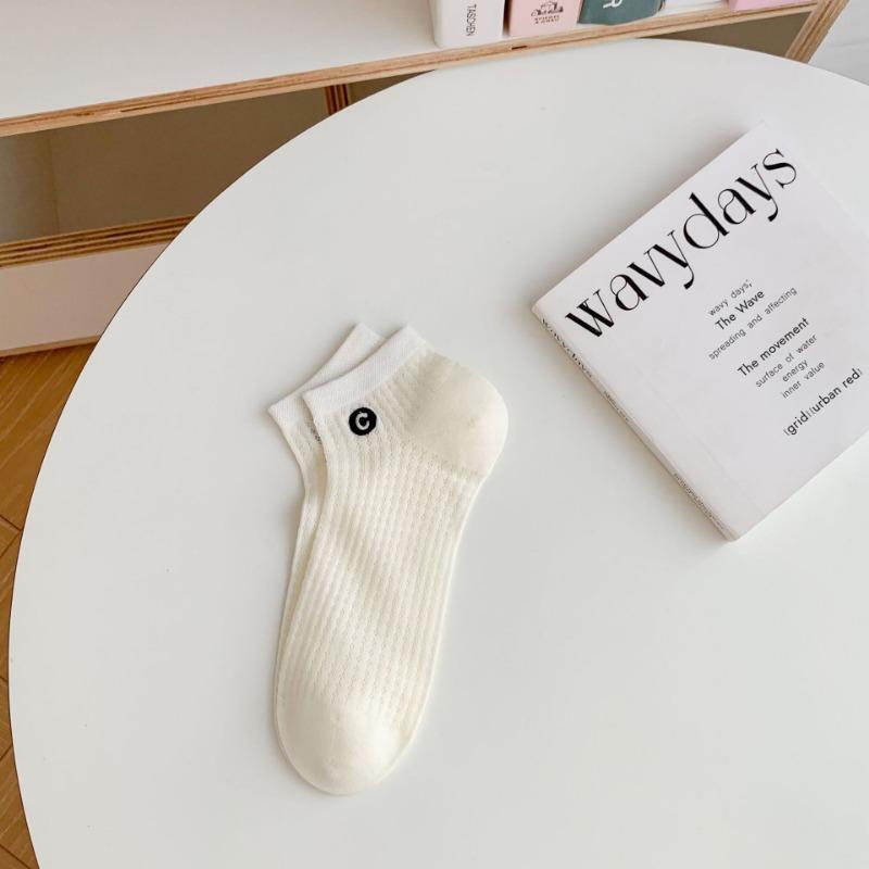 A Woman Wearing Summer Mesh Black and White Simple Embroidered Lettering Ultra-thin and Breathable Short Socks