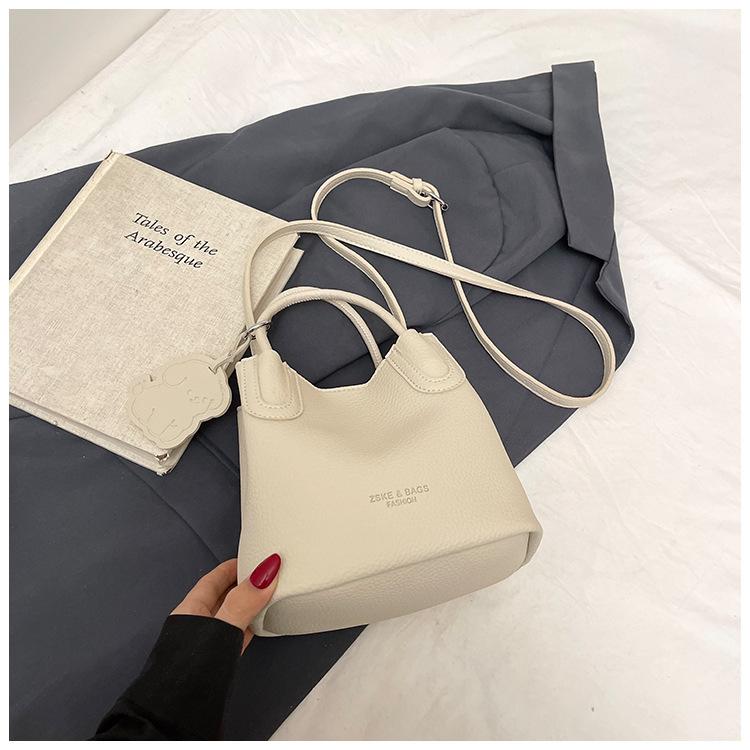 Textured foreign style small bag women's 2025 spring new popular versatile messenger bag fashionable women's portable bucket bag