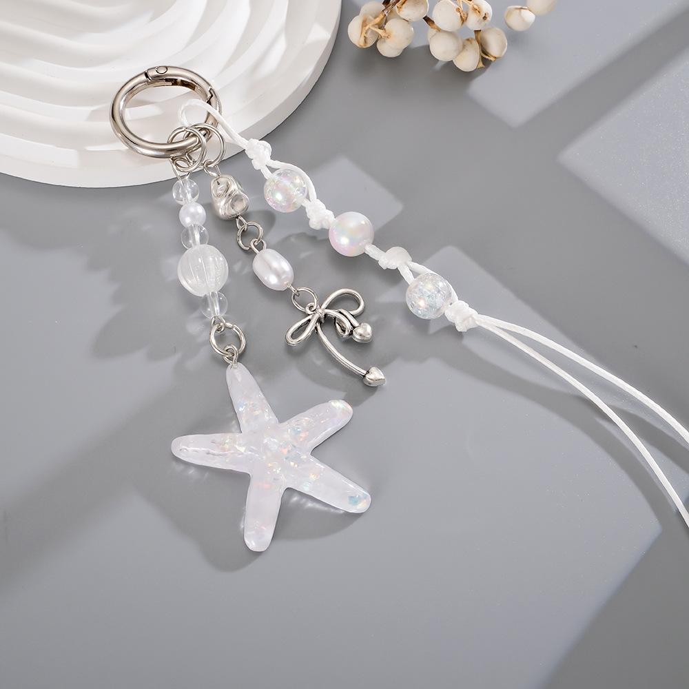 Handmade beaded woven rope pendant with colorful sequins and star-shaped design for mobile phone decoration.