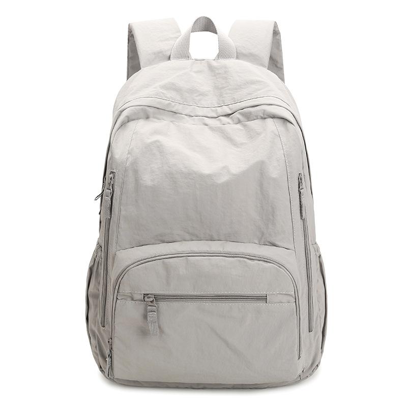 Ryggsäck i enfärgat dam lätt utomhusryggsäck stor kapacitet student skolväska