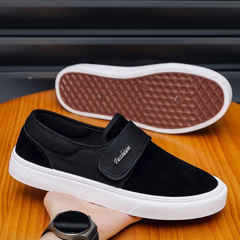 Fashion breathable versatile black and white color matching one-pedal Velcro low-top men's shoes student canvas board shoes