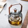 Pokaro Tea Heat-Resistant Glass Teapot, 1140ml, Integrated Steaming Function, Ink-Colored Design, Glass Tea Strainer, Wooden Handle, Stovetop Safe,