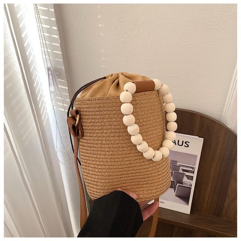 

New versatile messenger straw woven bag women s high-end woven bag shoulder handheld women s bag seaside vacation beach bag Drawing tape хаки