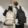The new bear graffiti backpack has a large capacity of foreign style tide and a couple of middle and high school students have a class backpack tide.