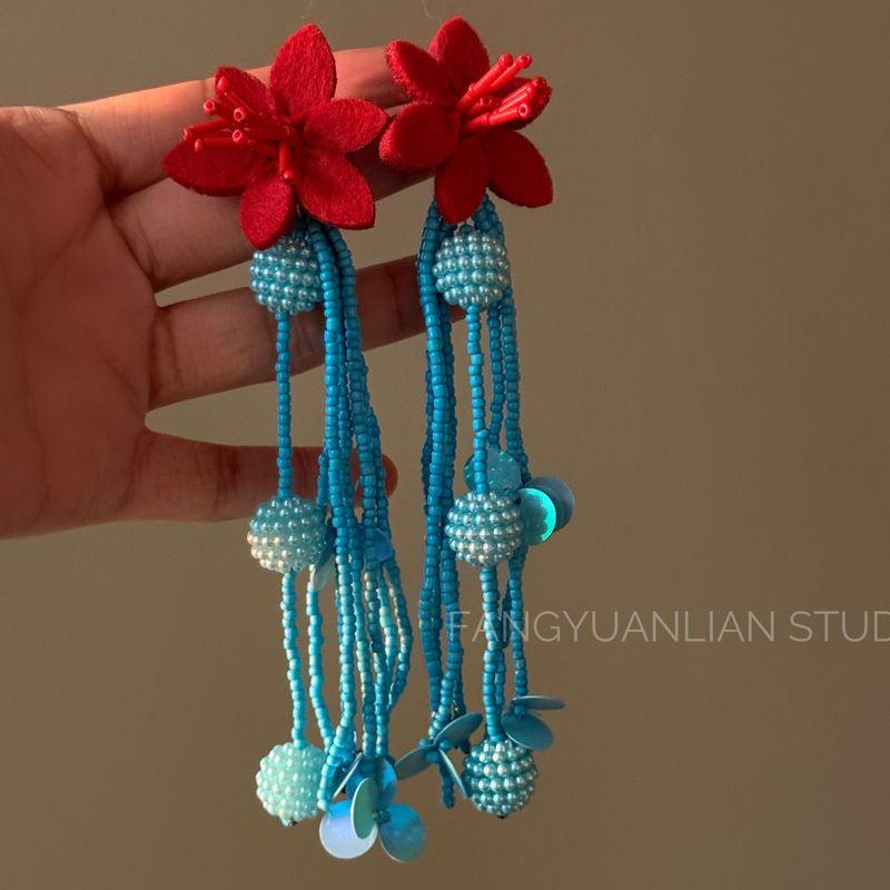 

Blue Bell Wind Retro Contrast Color Flower Tassel Earrings Female Elegant Ear Studs Vacation Style Ear Clip Ethnic Earrings A pair of red and blue earrings