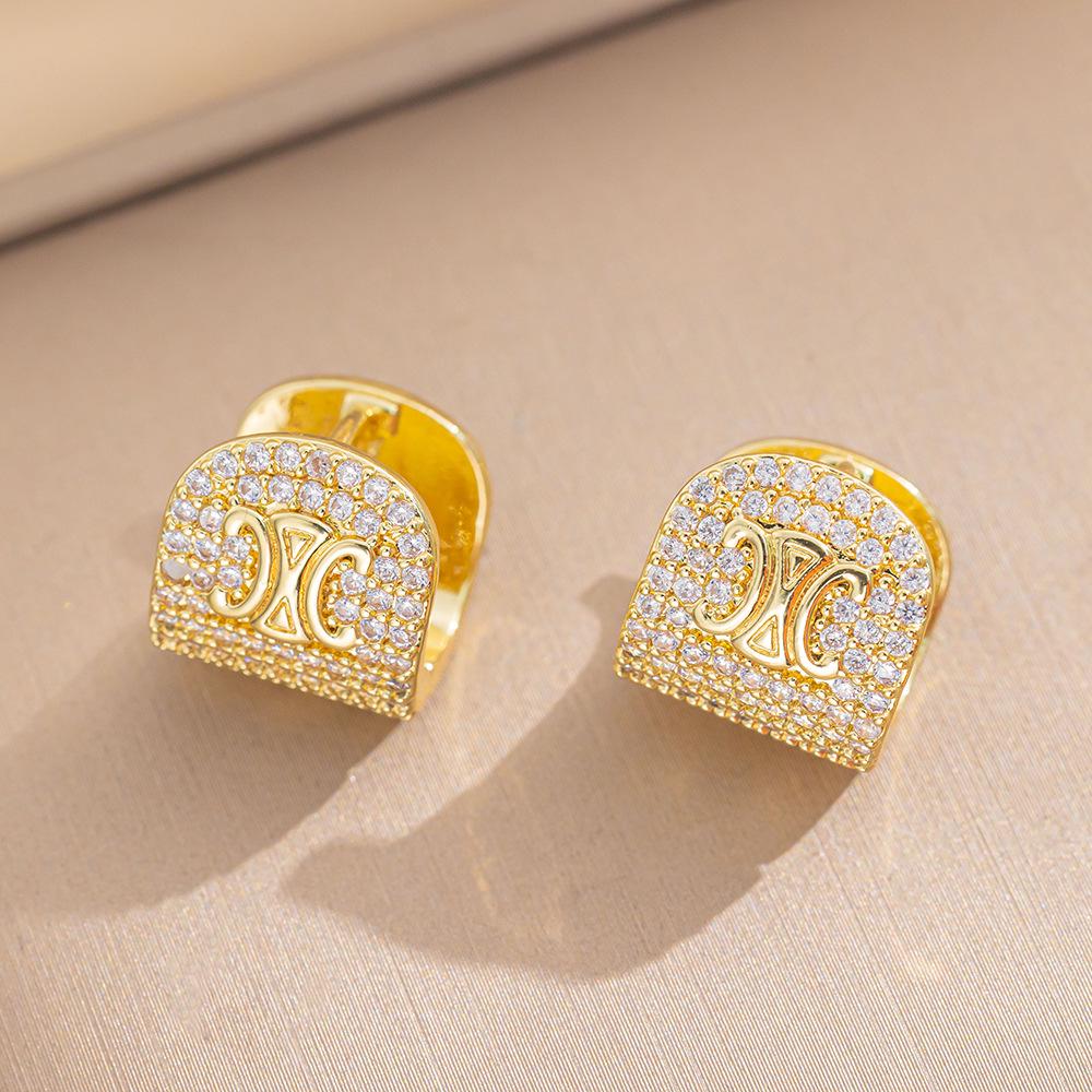 Eleganckie kolczyki sztyfty z cyrkoniami w kształcie koniczynki i misia - Nowy szykowny design