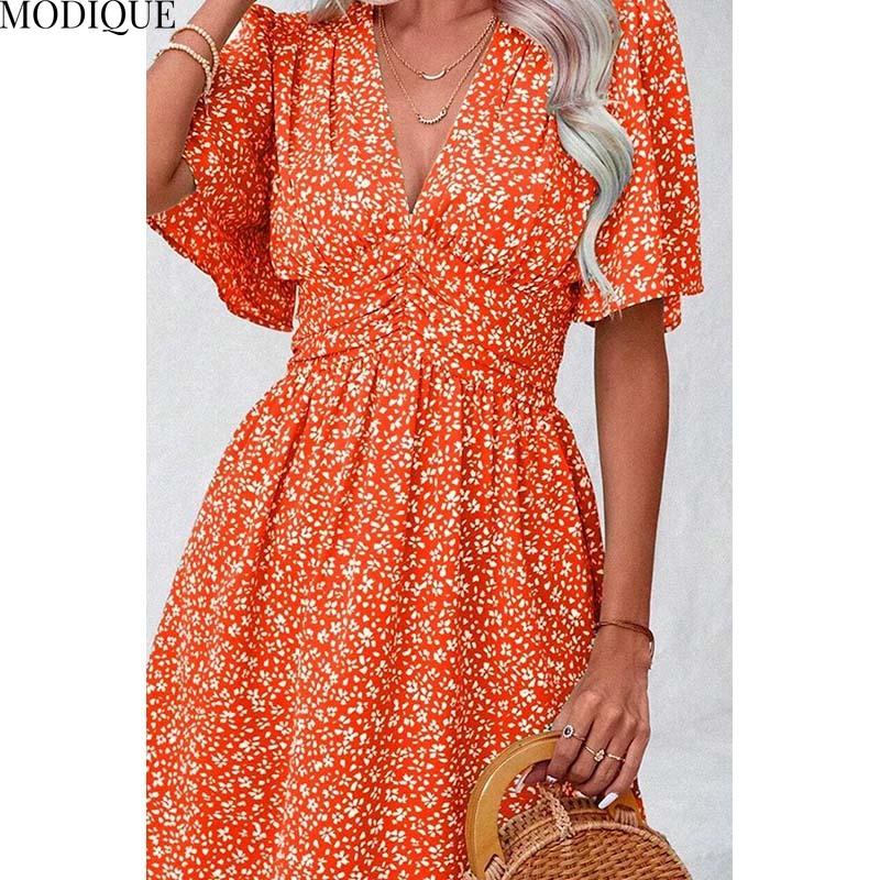 MODIQUE 2025 Summer New Women's Sexy Casual Floral Printing Ruffles Elastic Waist Short Dress Ladies X-Line Hot Batwing Sleeve V-Neck Dress