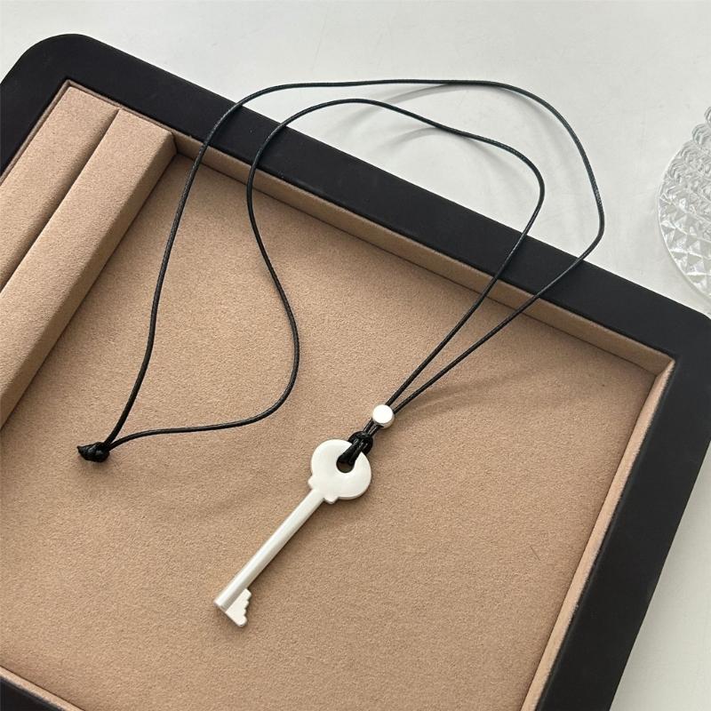 Elegant Metal Key Charm Black Rope Necklace Stylish Layering Pieces For Everyday Wear