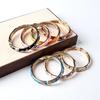 Old Beijing Ethnic Style Alloy Bracelet: Handmade Open Carved Design with Enamel Ornaments Inspired by Chinese Intangible Cultural Heritage.