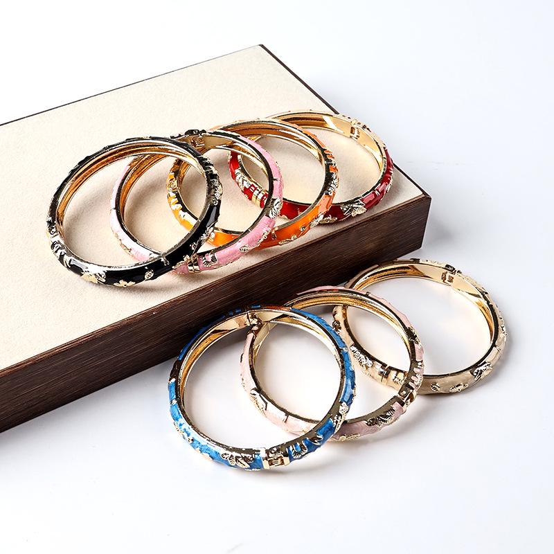 Old Beijing Ethnic Style Alloy Bracelet: Handmade Open Carved Design with Enamel Ornaments Inspired by Chinese Intangible Cultural Heritage.