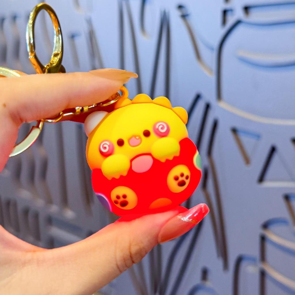 Mini llavero luminoso de huevo de dinosaurio: un bonito colgante para bolsos y llaves de coche.