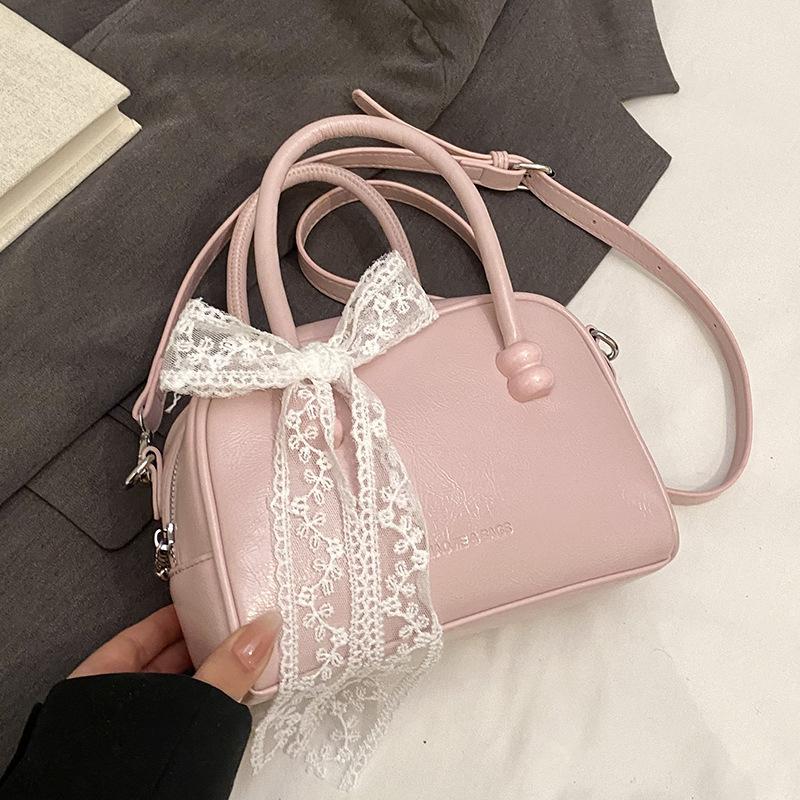 Korean version of the hot sale niche simple solid color hand pillow bag versatile fashion high texture commuter messenger bag women