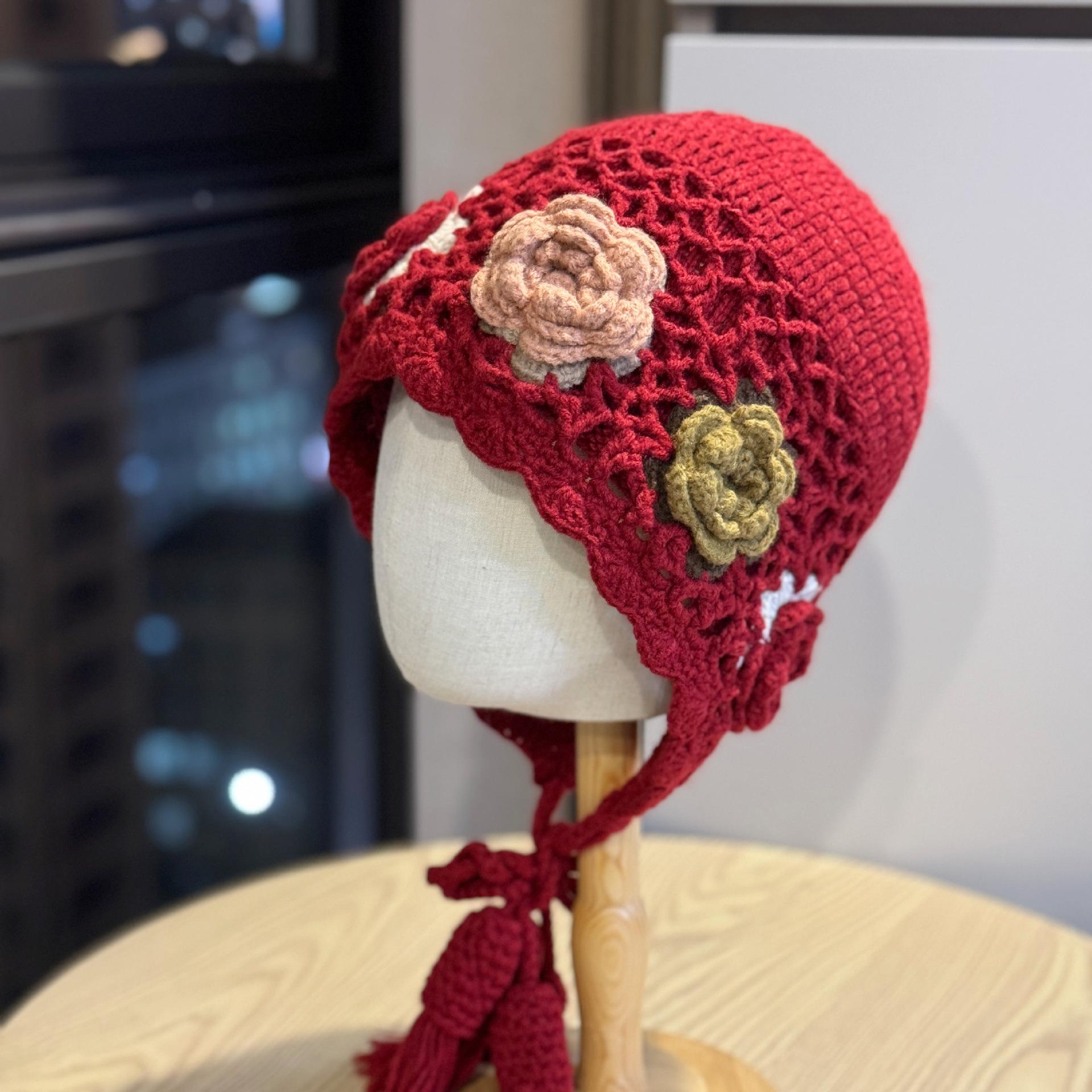 

Korean-style handmade crochet floral knitted pullover hat for women, autumn and winter warm ethnic style travel photography hat with tassels and ear Adult54-60Average Size вина червоного кольору