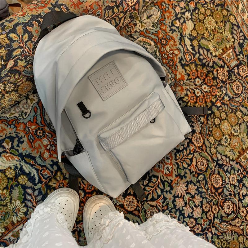 

Nylon backpack Korean version, junior high school student schoolbag, large capacity outdoor tide and high school student backpack серый