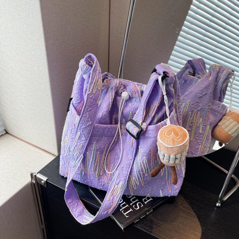 

Large-capacity soft fabric crossbody large bag women s 2024 new casual and lightweight tote bag fashionable commuter shoulder women s bag single package фіолетовий