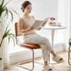 Elegantly crafted armless rattan dining chair in retro pastoral style, perfect for cafes, guesthouses, and vintage settings.