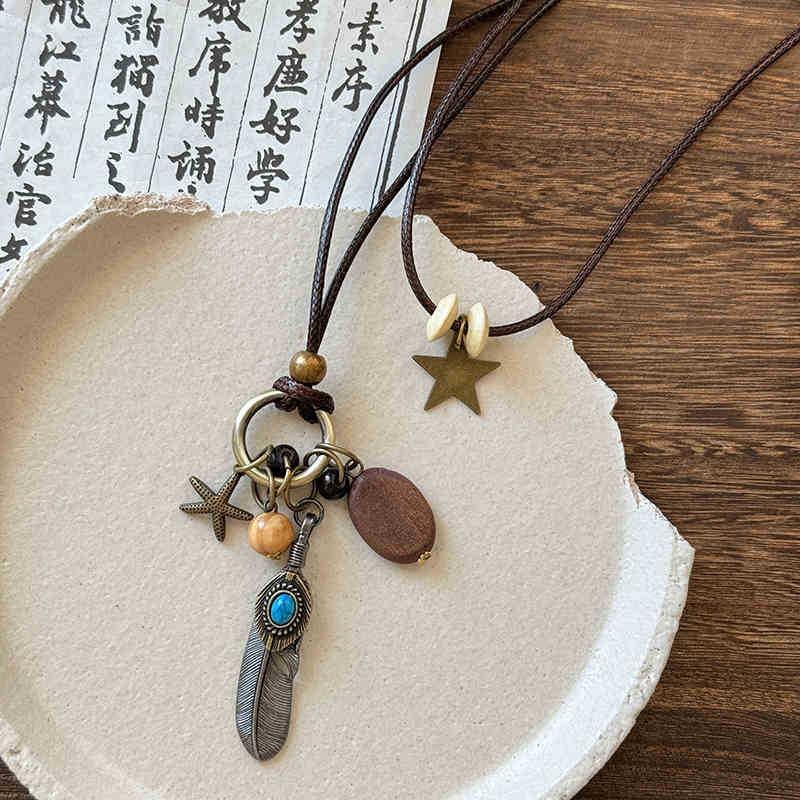 New Chinese leather pendant, fringed necklace, female ethnic style, niche retro sweater chain, fashion and high-end item jewelry.