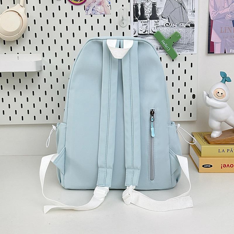Korean high-value backpack for junior high school students, casual, simple, fashionable and versatile, large capacity