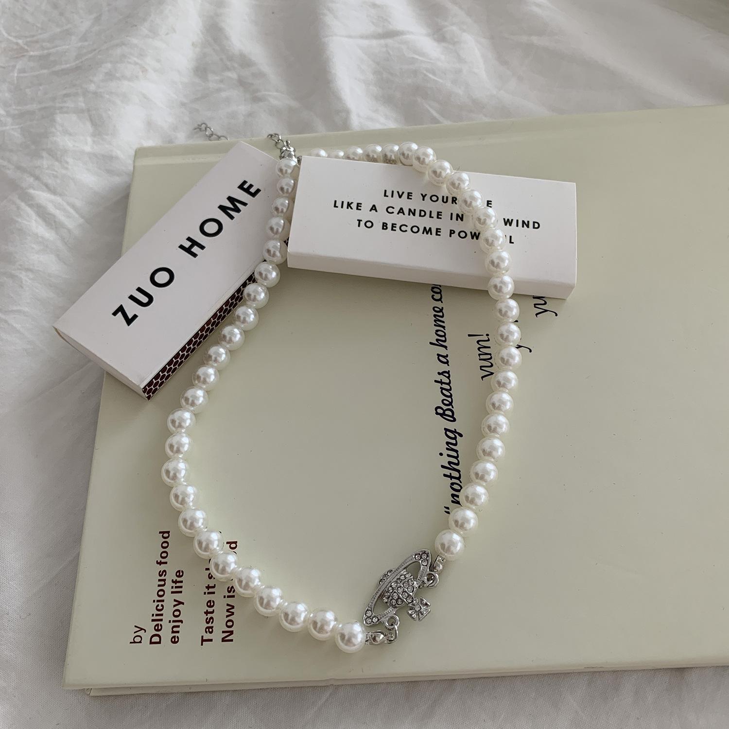 

Niche temperament Internet celebrity neck chain Saturn new trendy Korean retro elegant collarbone planet pearl necklace women