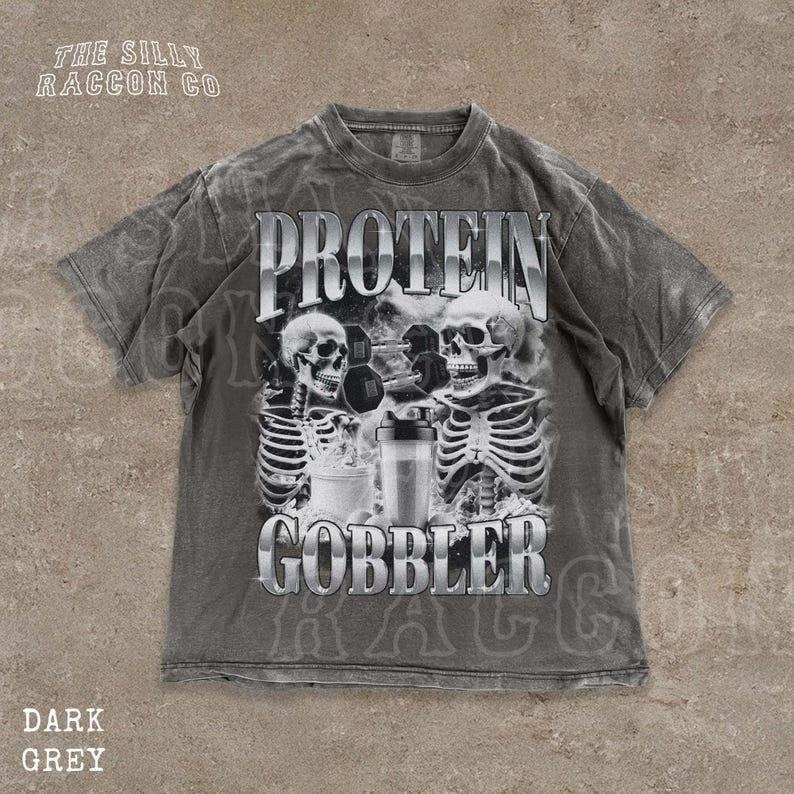 

Skull Gym Shirt Protein Gobbler Tee Weightlifting Apparel Ironic Skeleton Fitne Unisex T-Shirt M