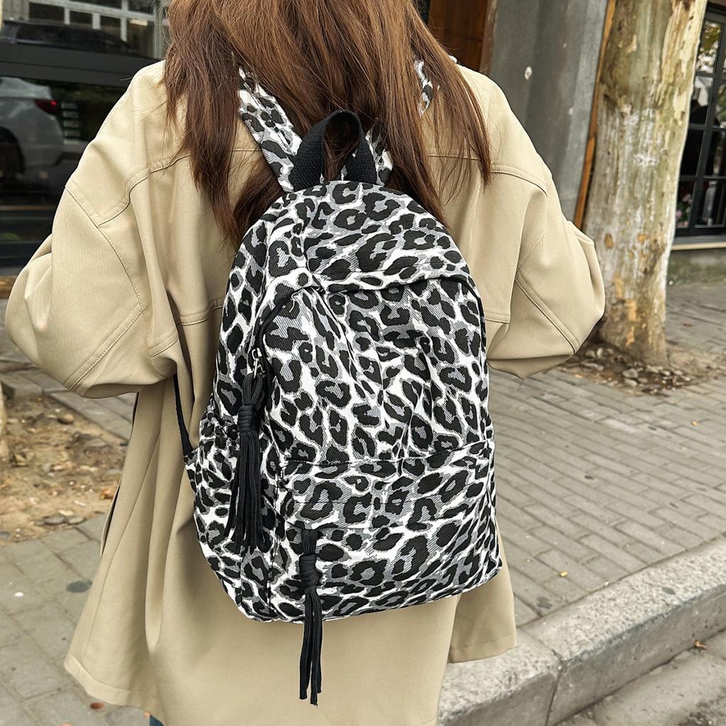 Leopard Print Backpack Casual Daily Use Trendy Street Style Lightweight Backpack for Women with Tassel Detail for School Travel and Everyday Outings