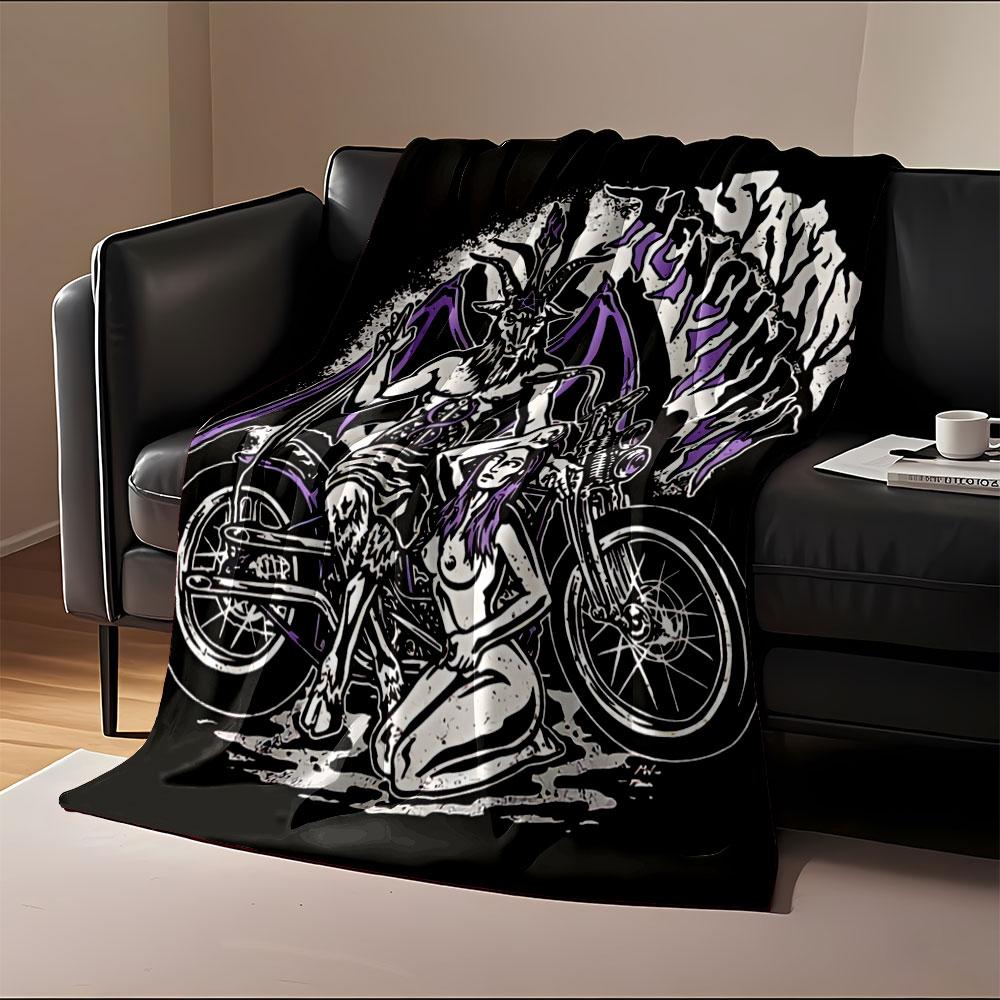 A goat-headed figure with wings and a seated woman beside a motorcycle. for all seasons blanket lunch break throw gift