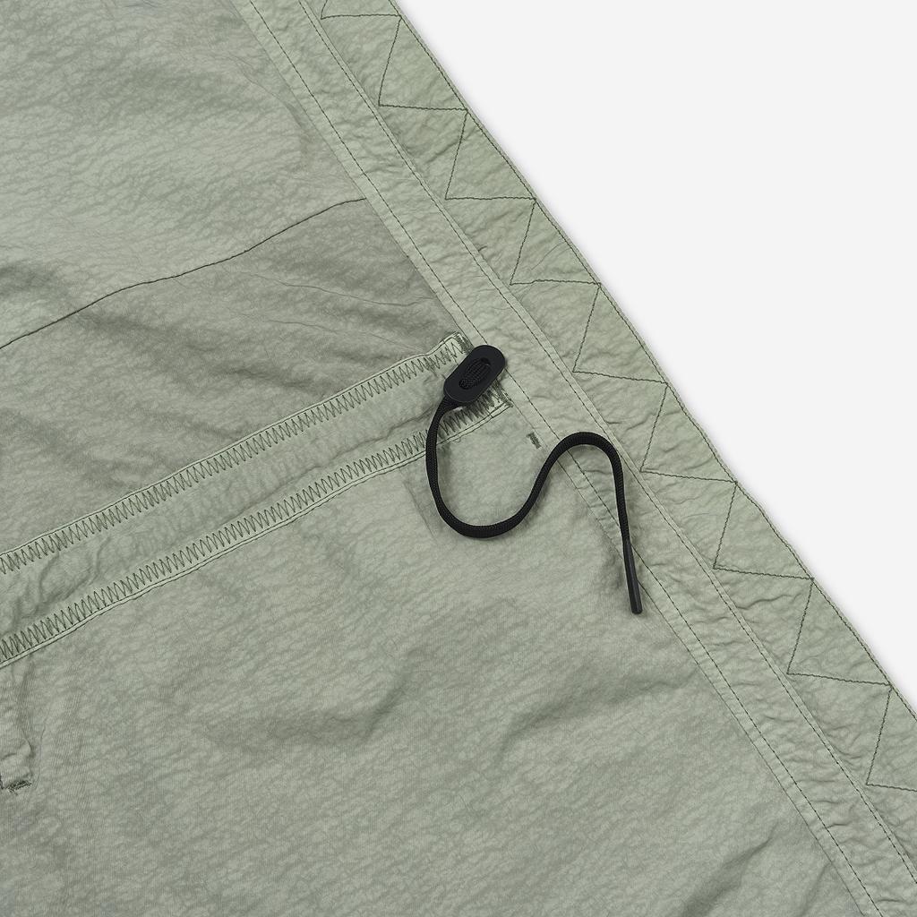 Nike Jednolita tkana kurtka z dużymi kieszeniami i wiatroszczelnym designem Odzież wierzchnia męska Szaro-zielona BV4431-371