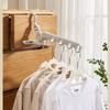 Four clip-on portable hangers and one folding hanger for easy storage. Ideal for travel, business trips, and indoor laundry drying. (4 colors availabl