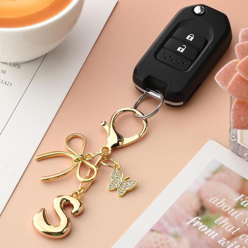 Chaveiro Fashion Borboleta Letra A-Z Feminino Menina Brilhante Fofo Mochila Chave de Carro Acessórios Cordão Pingente de Metal com Letra Presente