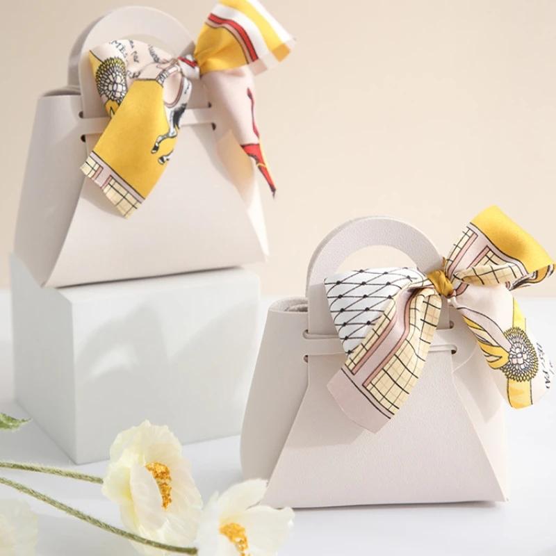 10 pezzi distribuiscono sacchetti regalo in pelle rosa, bomboniere per ospiti, mini borsetta con nastro, scatola per imballaggio di caramelle, decorazioni per feste