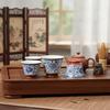 Blue and White Porcelain Lotus Kung Fu Tea Set: Enamel Teacup, Hovering Lid, Teapot, Saucer, and Master Cup.