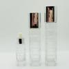 Kare Cam Cilt Bakım Seti: 100ML ve 120ML Tonik/Losyon Şişeleri, 40ML Serum Şişesi, 50g ve 30g Krem Kavanozları.