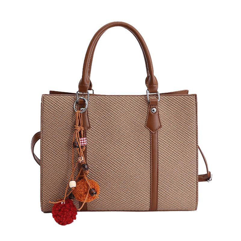 

Korean version of fashionable women s bags, large-capacity portable shoulder bags, new bags, simple niche temperament tote bags without pendant model