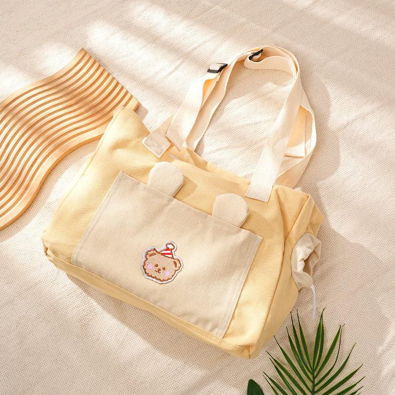 Stylish and portable cat carrier for outings, lightweight, large-capacity, cute open-top crossbody bag for kittens and puppies, small handbag