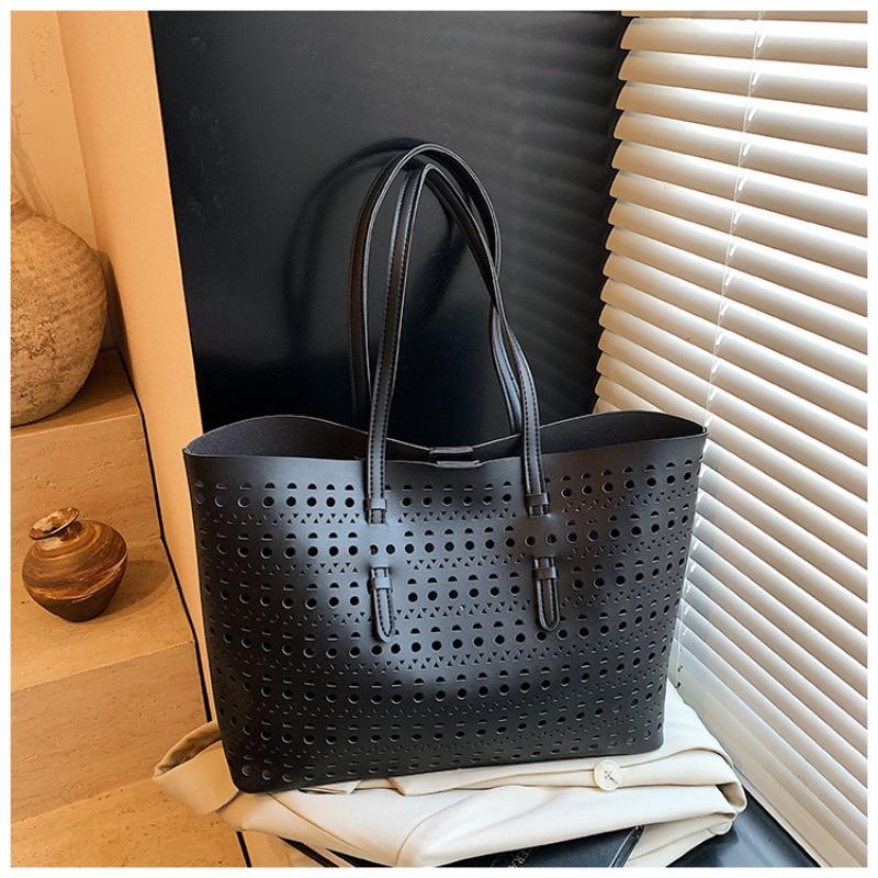 Large-capacity tote bag niche design simple hollow bag women's summer new versatile shoulder bag